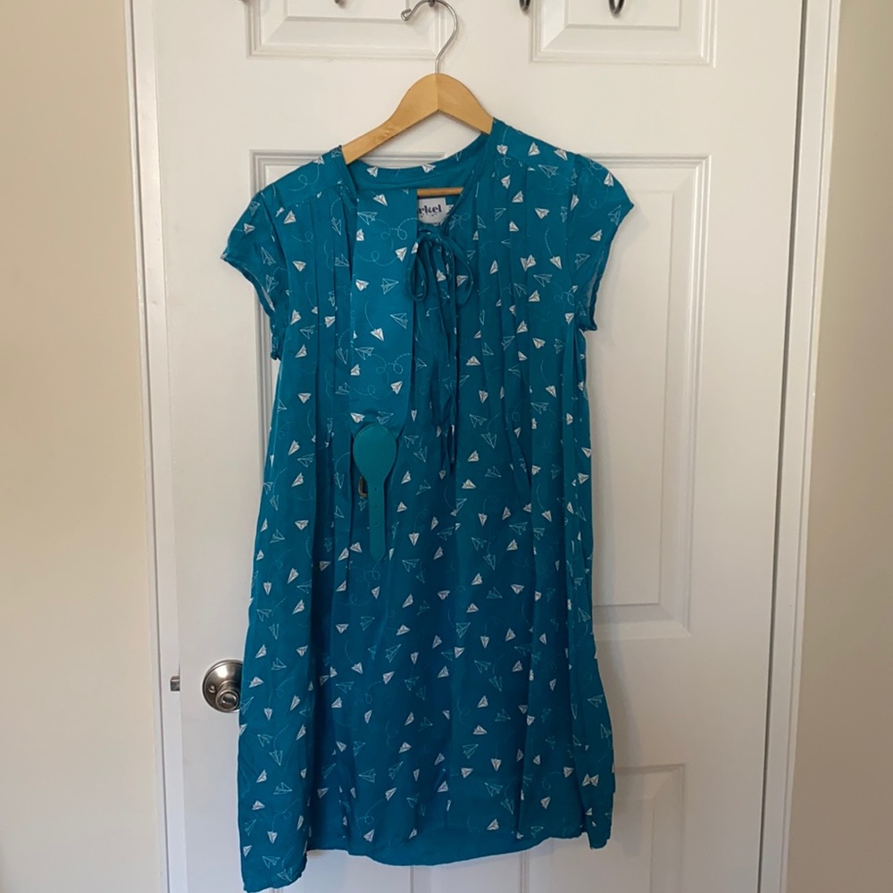 Paper airplane pleated shirt dress